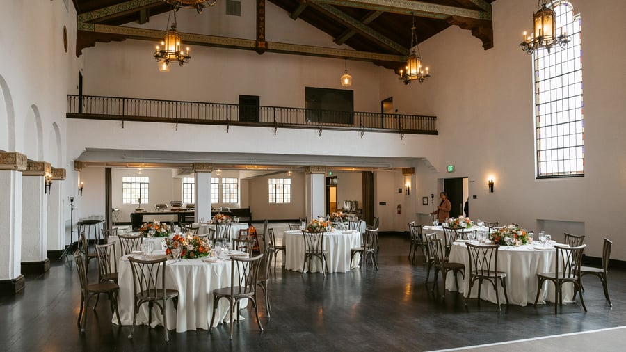 Expansive indoor reception with historic stylings and vaulted ceilings at Fillmore Chapel by Wedgewood Events