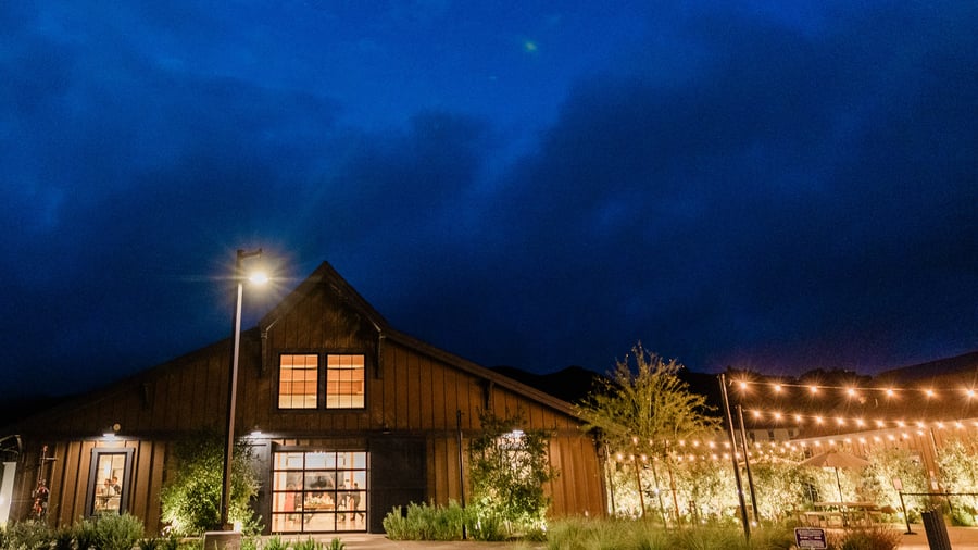 Night time event with barn style reception hall - Canopy Grove by Wedgewood Events
